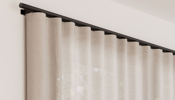 Lutron Palladiom motorized drapery hanging from a traditional-style drapery rod
