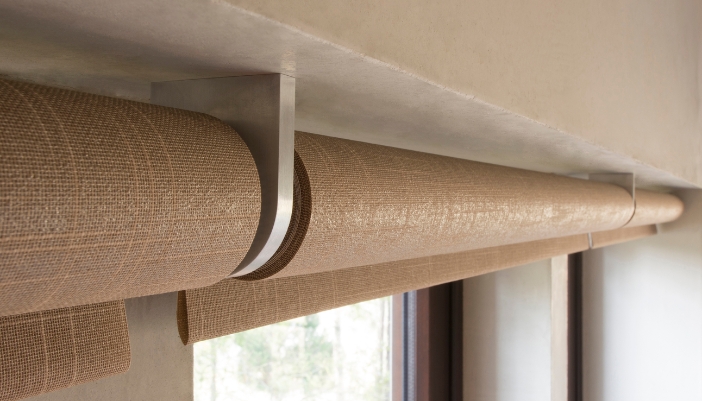 Savant shade pocket concealing an automated window shade within the surrounding architecture
