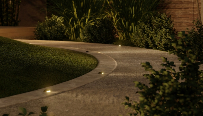 An outdoor path lit by small outdoor lights.