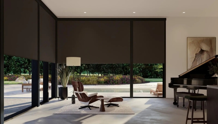 A modern sitting area with dark, luxury motorized shades.