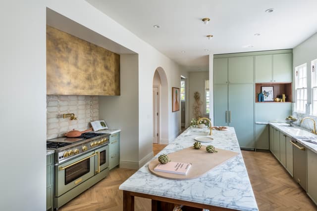 Front view of a luxury kitchen with a BlueStar range