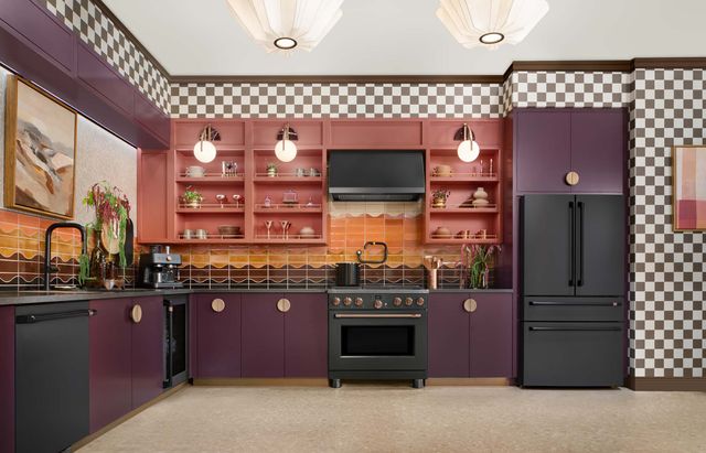 Front view of a modern kitchen with a matte black Cafe kitchen appliance package