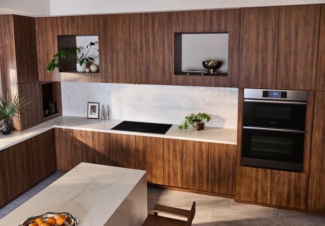 Front view of a modern kitchen with Dacor contemporary appliances