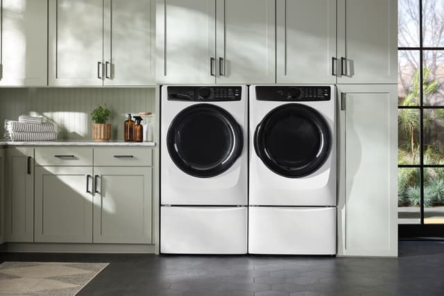 Front view of a modern laundry room with an Electrolux washer and dryer