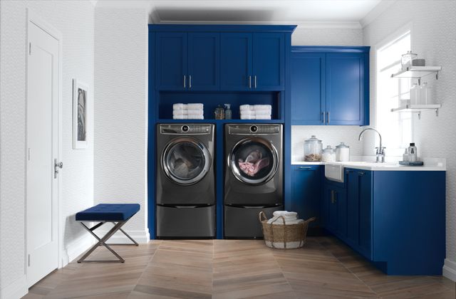 Credit: Electrolux Front view of a modern laundry room with an Electrolux washer and dryer