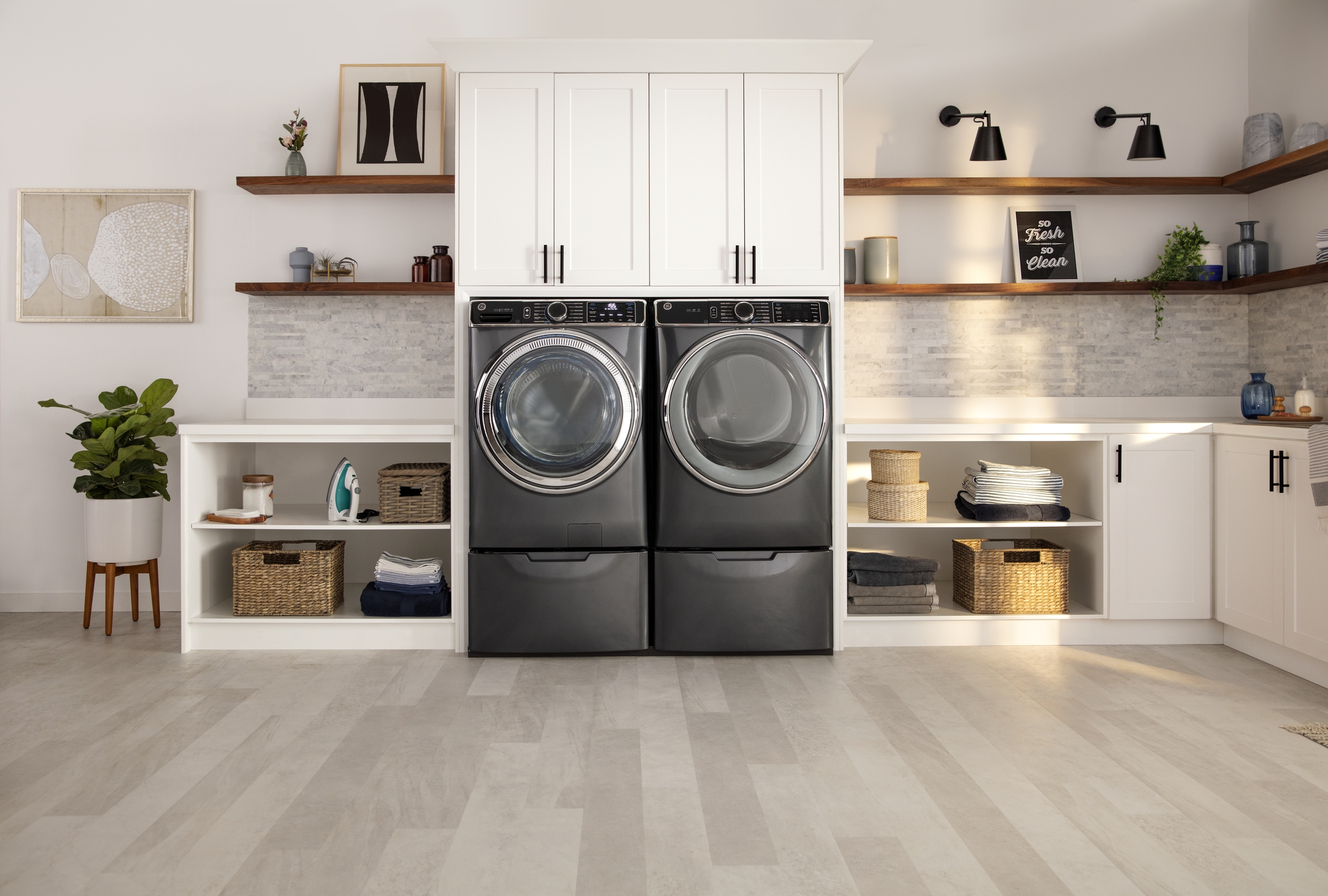 Stackable GE Washer and Dryer in modern laundry room