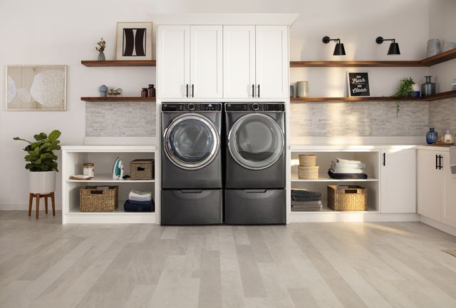 Credit: GE Front view of a modern laundry room with a GE front load washer and dryer