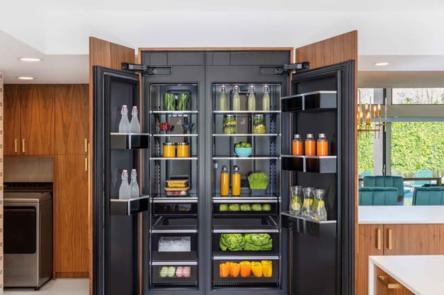Front view of an opened JennAir refrigerator in a modern kitchen