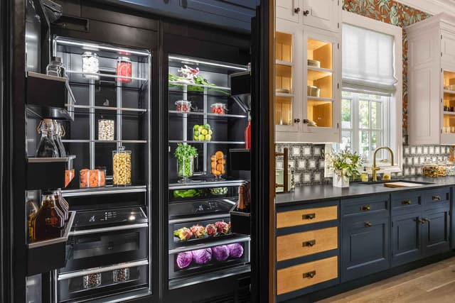 Front view of a modern kitchen with an opened JennAir refrigerator