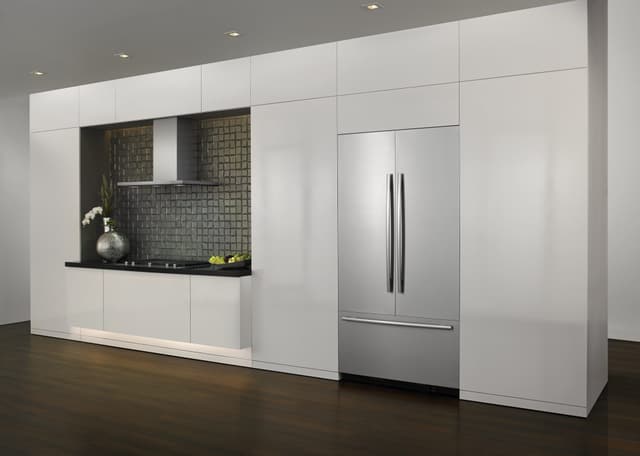 Front view of a luxury kitchen with a built in JennAir refrigerator