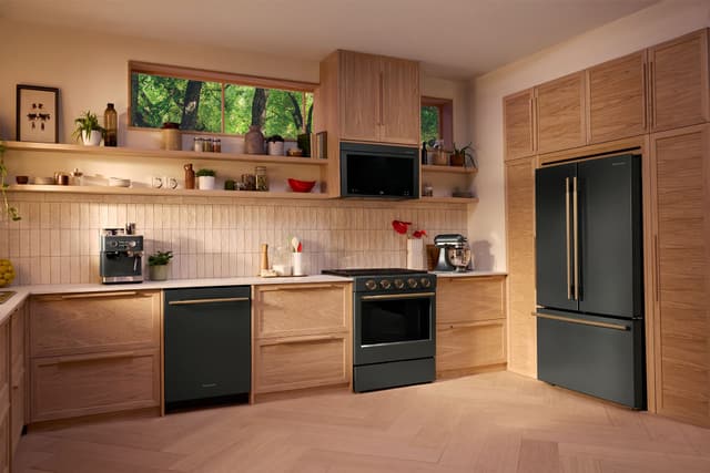 Front view of a kitchen with a black stainless steel Kitchenaid appliance package Front view of a kitchen with a black stainless steel Kitchenaid appliance package