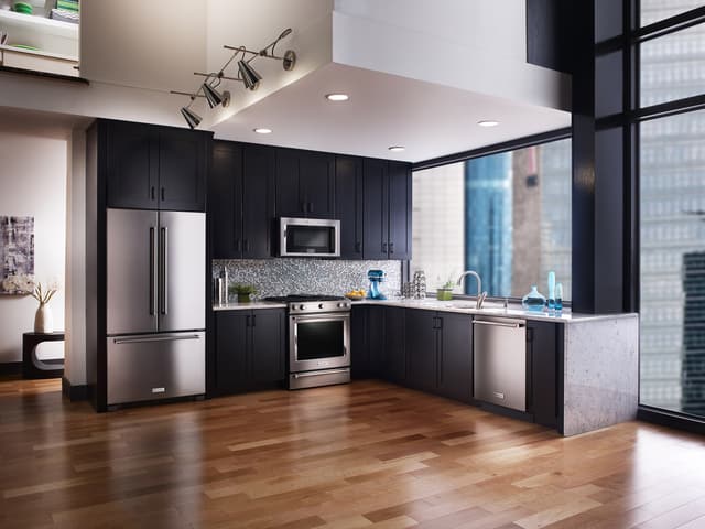 Front view of a modern kitchen with KitchrnAid appliances Front view of a modern kitchen with KitchrnAid appliances