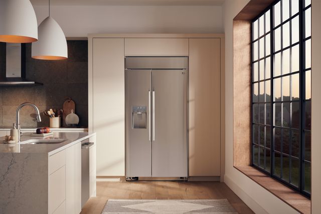 Credit: LG Studio Front view of a modern kitchen with an LG Studio side by side refrigerator