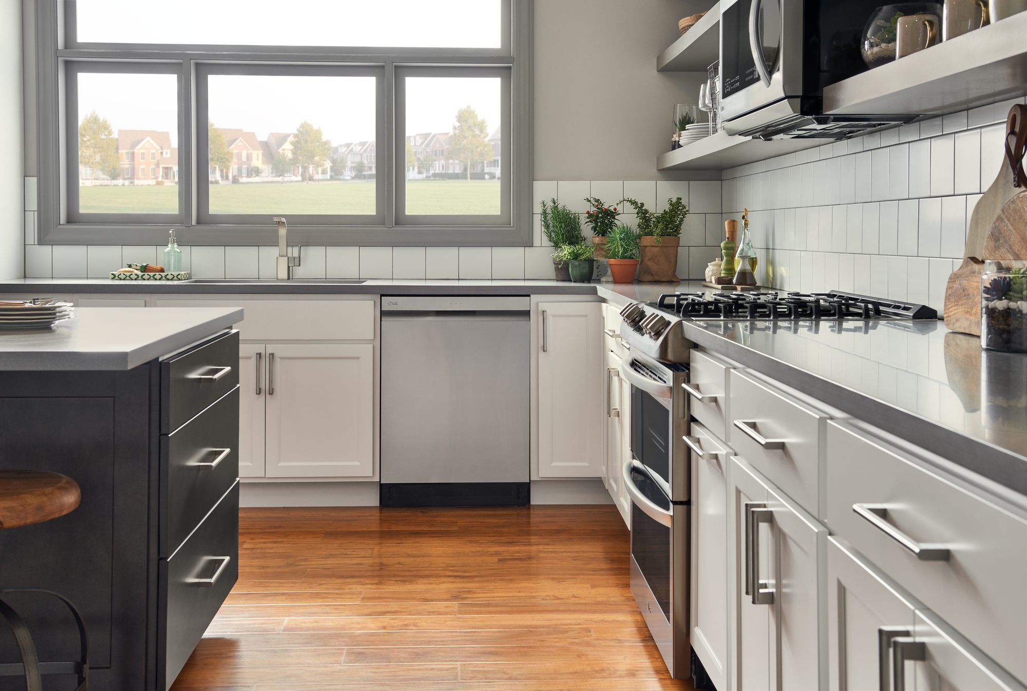 Front view of a modern kitchen with a closed LG dishwasher Front view of a modern kitchen with a closed LG dishwasher