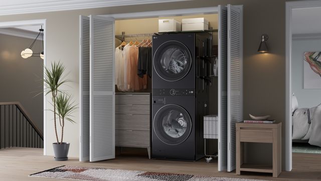 Front view of a stacked LG washer and dryer in a modern laundry closet