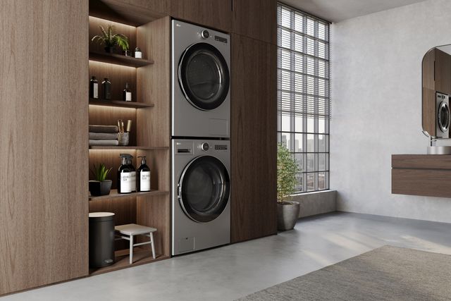 Front view of a luxury laundry room with a stacked LG washer and dryer