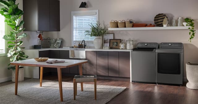 Front view of a casual kitchen and laundry space with an LG washer and dryer