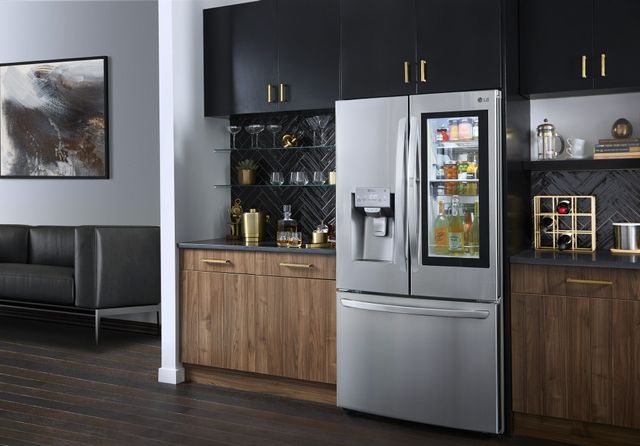 Front view of a modern kitchen with a stainless steel LG refrigerator