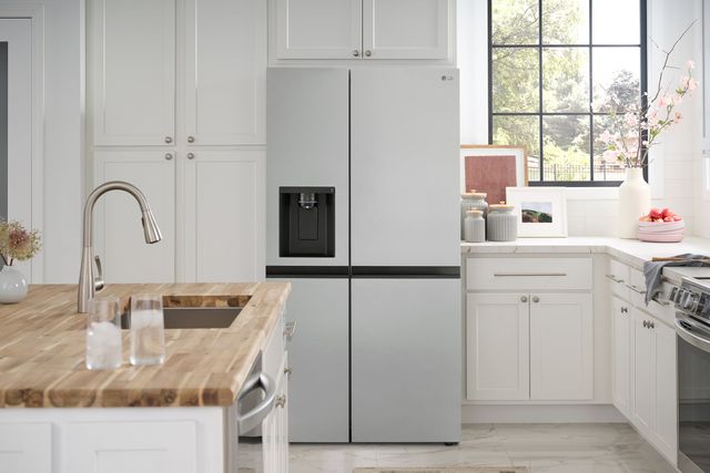 Credit: LG Front view of a modern kitchen with a stainless steel four door refrigerator from LG