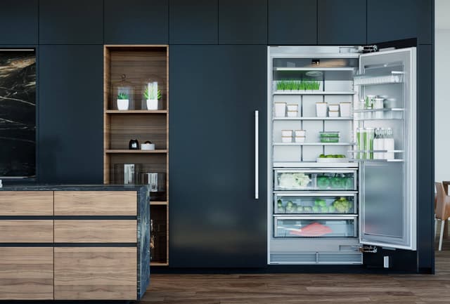 Front view of a luxury kitchen with a paneled Liebherr column refrigerator Front view of a luxury kitchen with a paneled Liebherr column refrigerator