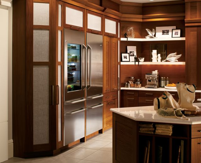 Front view of a modern kitchen with two Monogram built in refrigerators