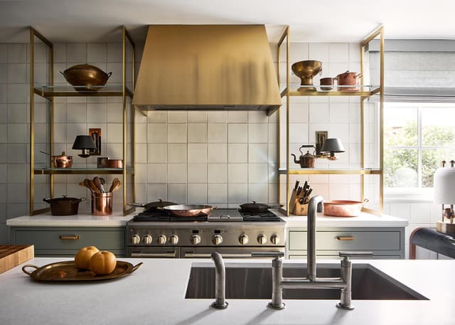 Credit: Monogram Front view of a modern kitchen with a Monogram range and range hood