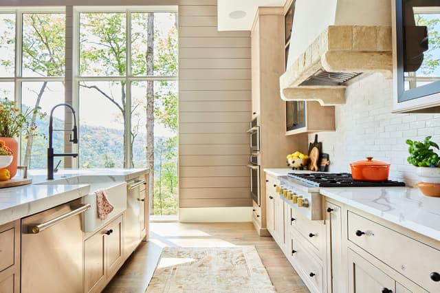 Credit: Monogram View of a modern kitchen with Monogram appliances including an insert range hood