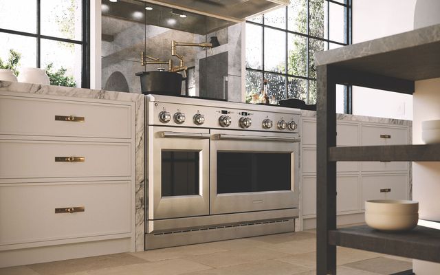 Low view of a luxury kitchen with a Monogram dual fuel range