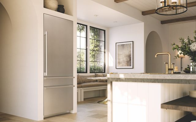 Front view of a modern kitchen with an integrated Monogram refrigerator