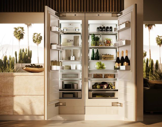 Front view of an opened Monogram refrigerator in a mdoern kitchen