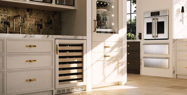 Front view of a modern kitchen with Monogram wine cooler and beverage center
