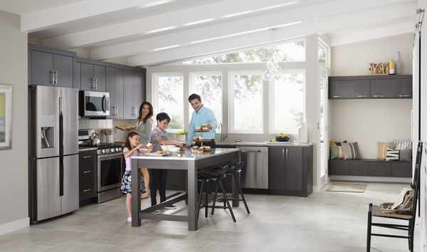 Family All Together in Their Kitchen