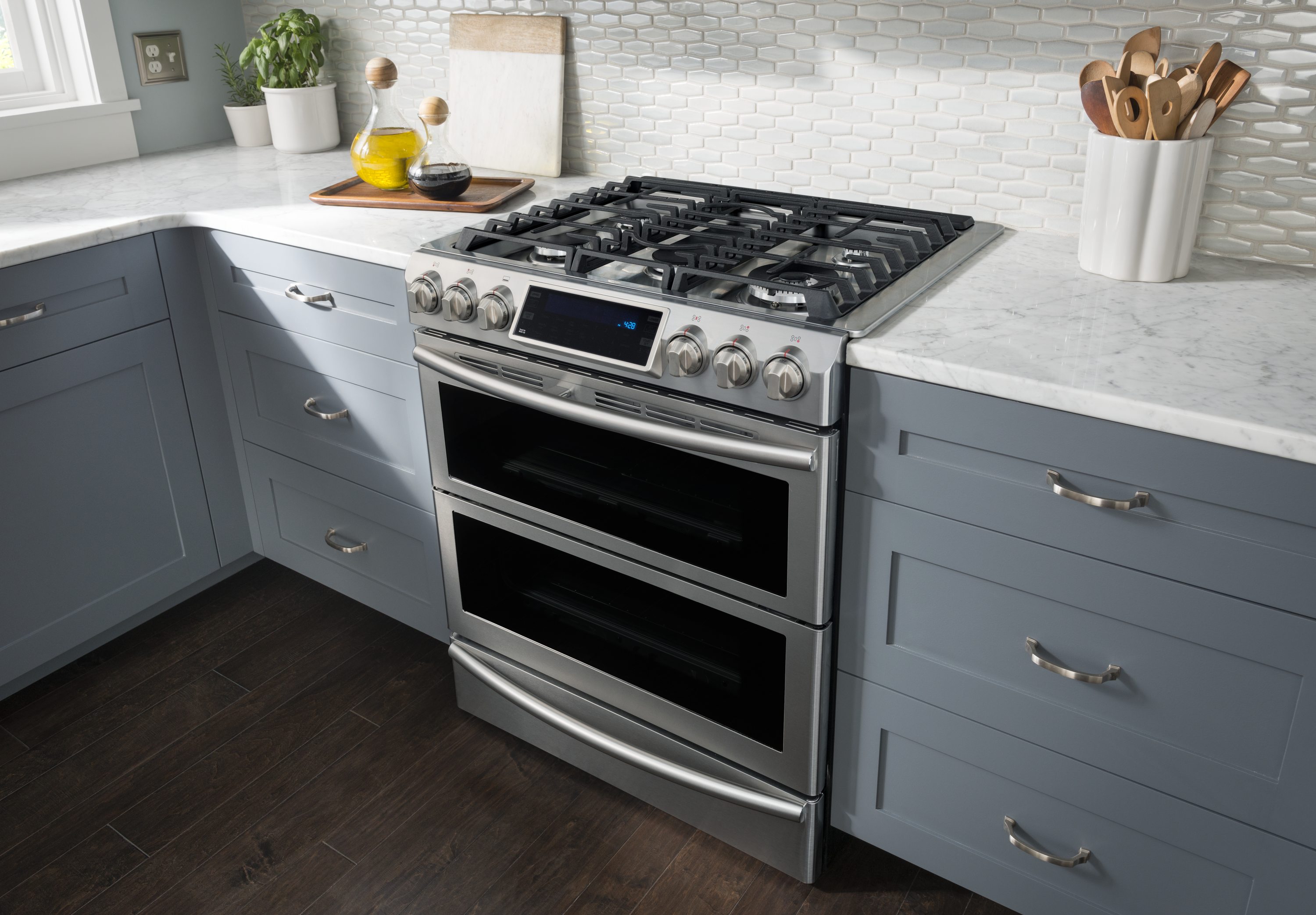 Front view of a Samsung gas slide in range in a modern kitchen