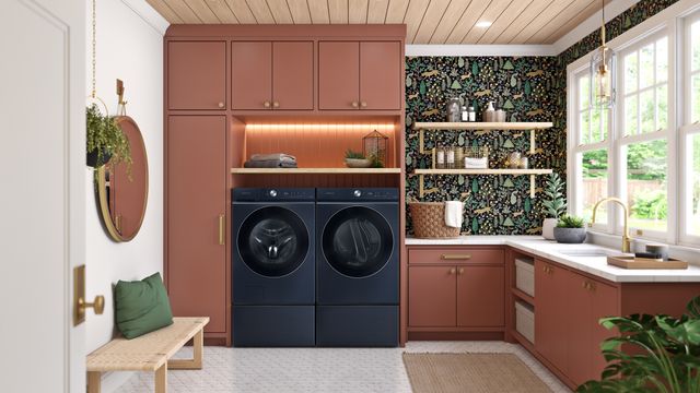 Front view of a modern laundry room with a blue Samsung washer and dryer set.