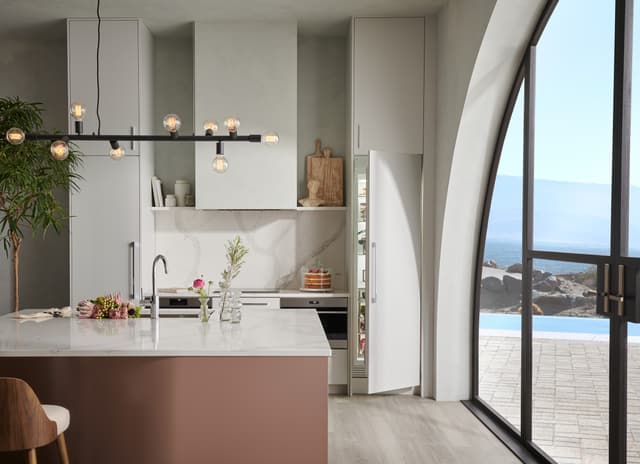 Credit: Sub-Zero Front view of a luxury kitchen with a built in Sub-Zero column refrigerator