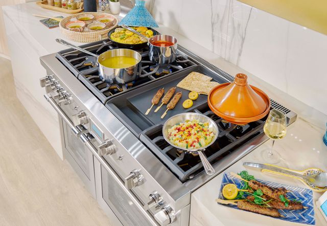 Credit: Thermador Front view of a dinner being cooked on a Thermador range