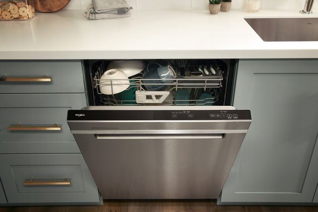 Front view of a slightly opened Whirlpool top control dishwasher