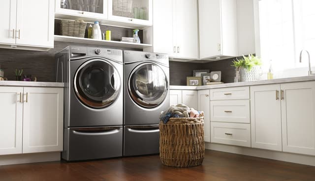 Close view of a Whirlpool washer and dryer in a modern laundry room