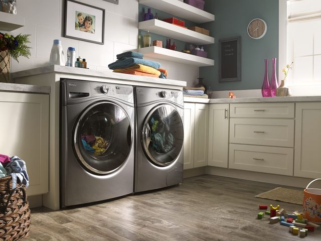 Low angled view of a modern laundry room with a Whirlpool washer and dryer