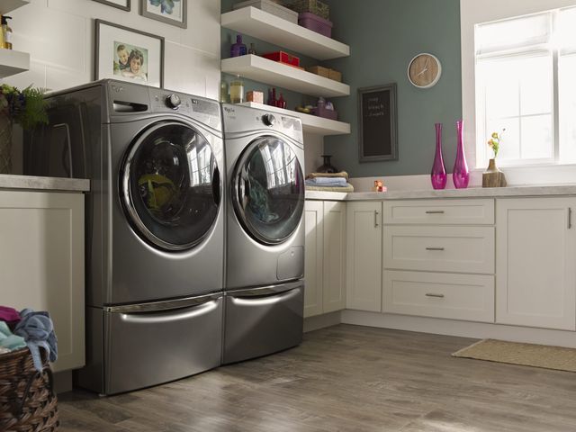 Credit: Whirlpool Front low view of a Whirlpool washer and dryer in a modern laundry room