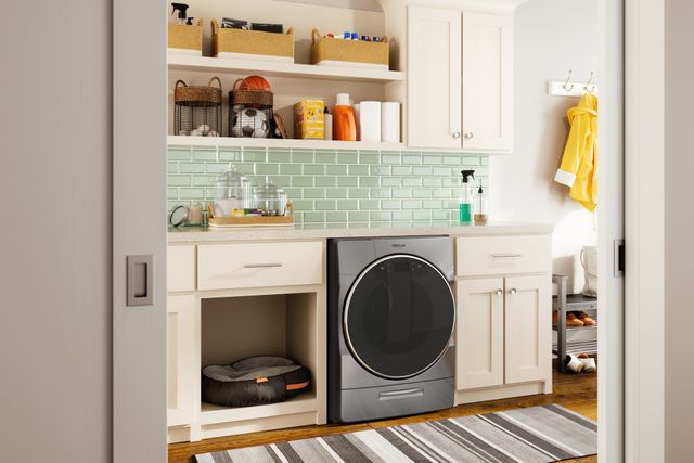 Front view of a modern laundry room with a Whirlpool washer and dryer combo