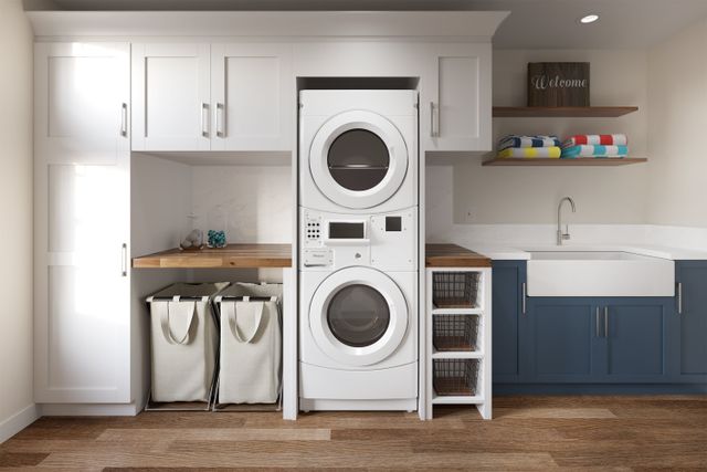 Stacked Whirlpool laundry units in a utility room