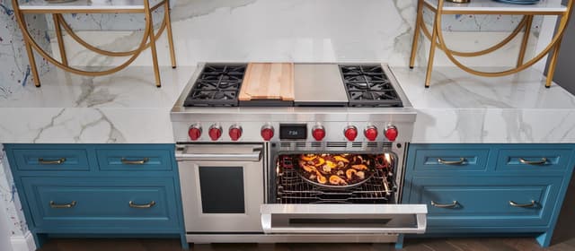 Credit: Wolf Opened Wolf range oven in a modern kitchen