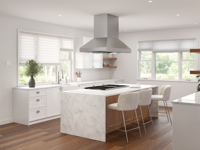 Front view of a modern kitchen with an island range hood over a kitchen island