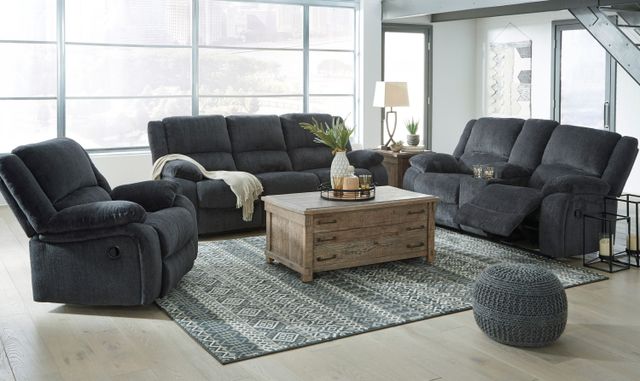 Front view of a modern living room with dark grey cloth furniture