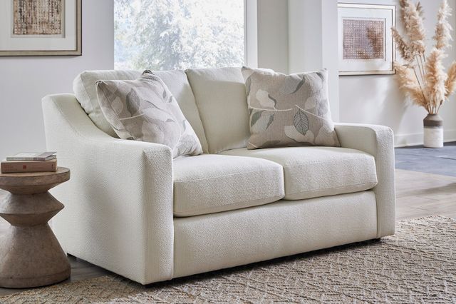 Front view of a modern living room with a small loveseat