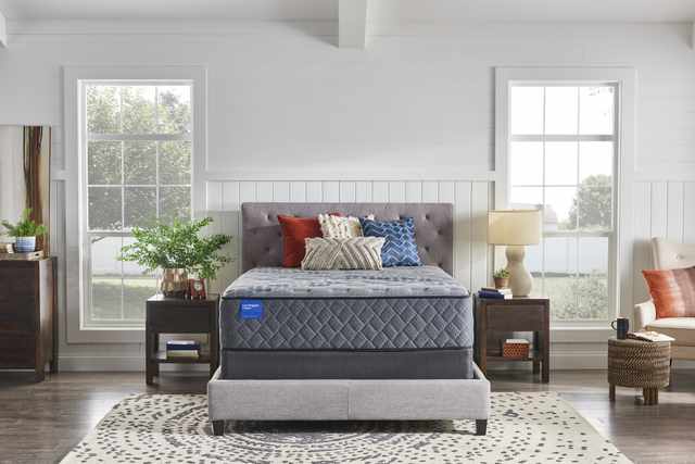 Sealy Carrington Chase Tight Top Firm Mattress in a bedroom setting
