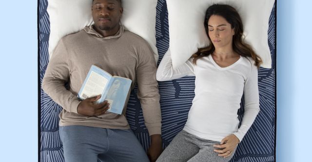 Top view of a couple sleeping on a Serta mattress