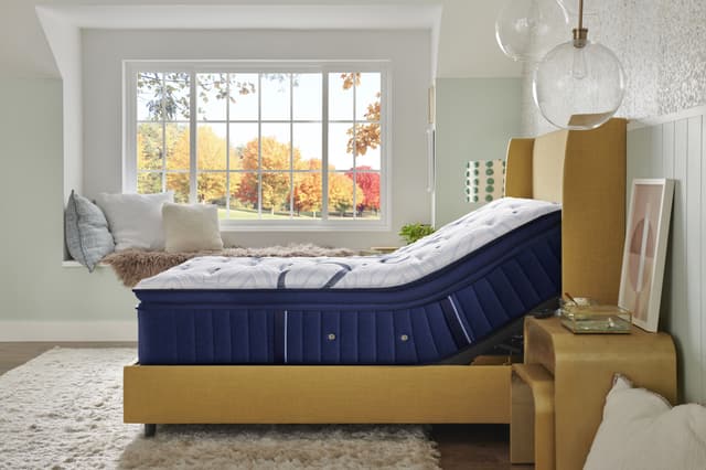 Side view of a Stearns and Foster mattress on and adjustable frame Side view of a Stearns and Foster mattress on and adjustable frame