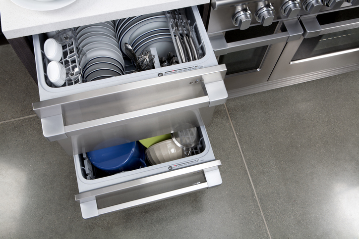 Drawer dishwasher with drawers pulled out and full of dishes